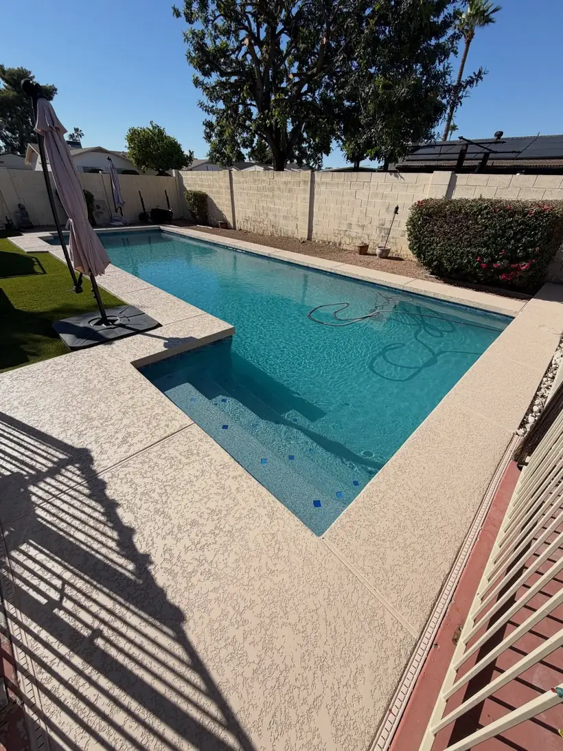 Rectangular pool with clean new decking