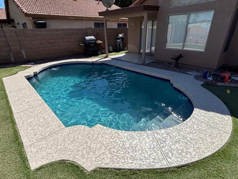 Freeform pool with resurfaced deck