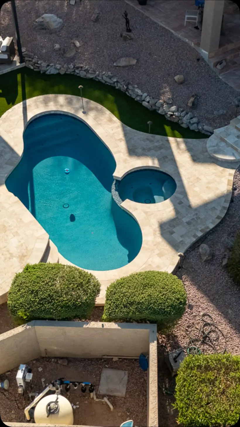 Overhead view of a resurfaced pool and spa