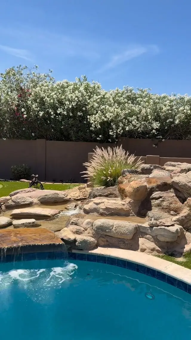 Rock waterfall feature into a pool
