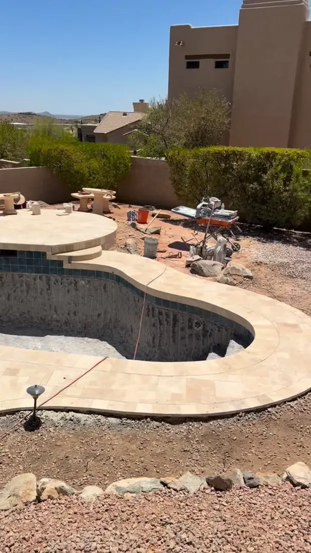 Old pool surface chipped out down to the shell