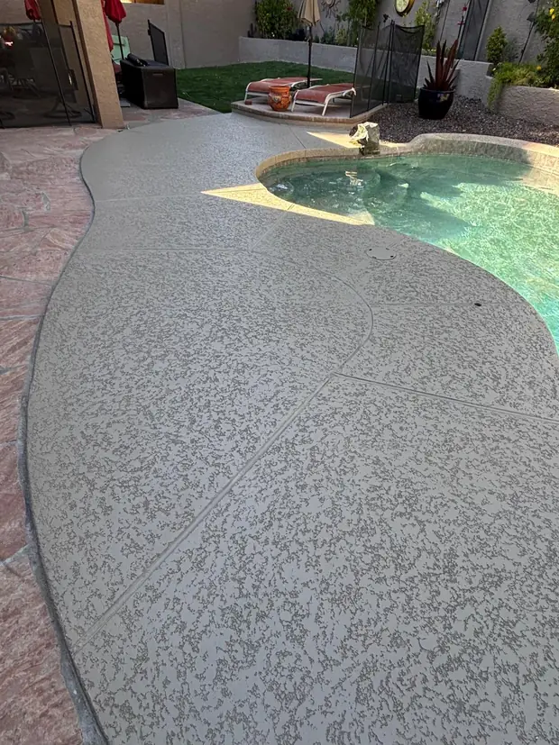 New pebble surface applied to a pool shell